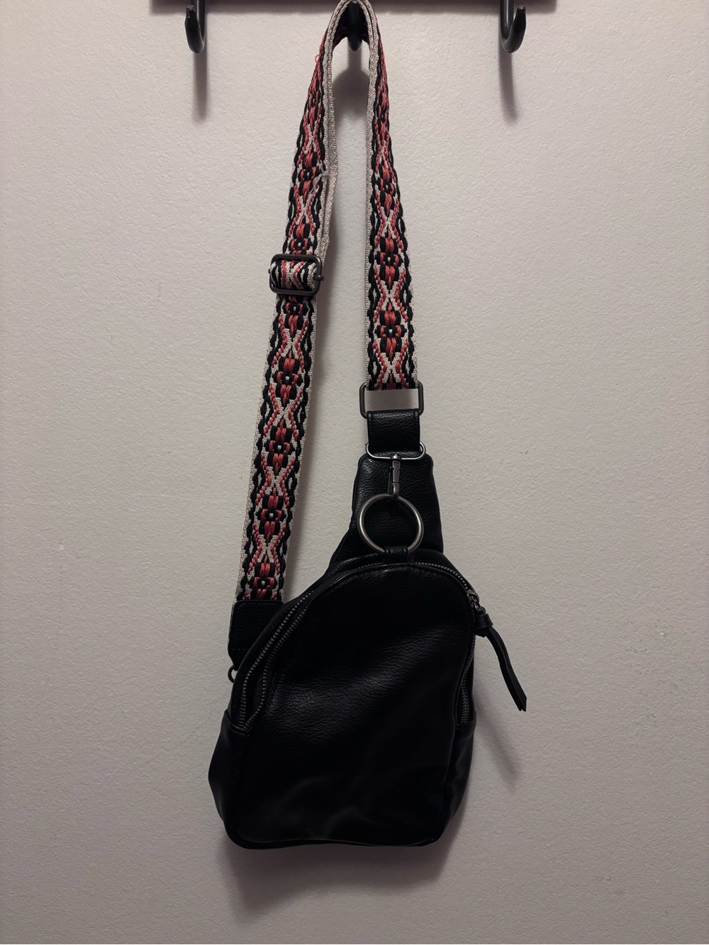 Black Leather Crossbody Sling Bag with Patterned Strap